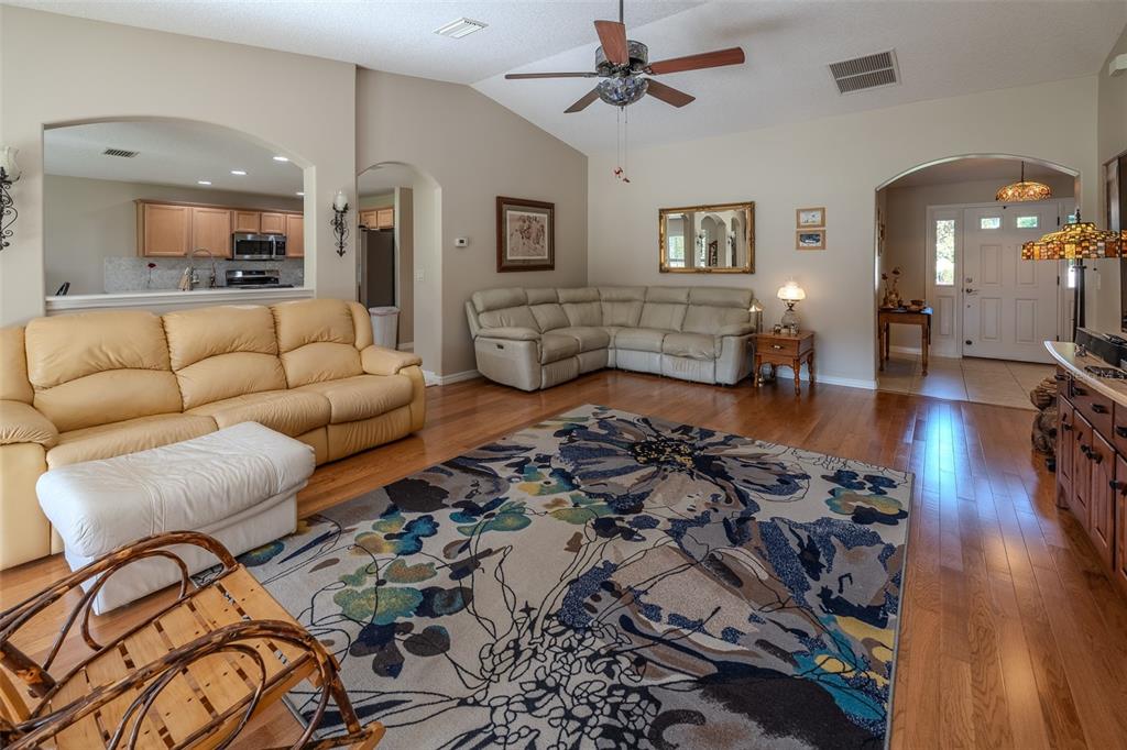 16023 Southwest 14th Avenue Road Ocala, FL 34473 - Photo 9 of 57 a living room with furniture and wooden floor