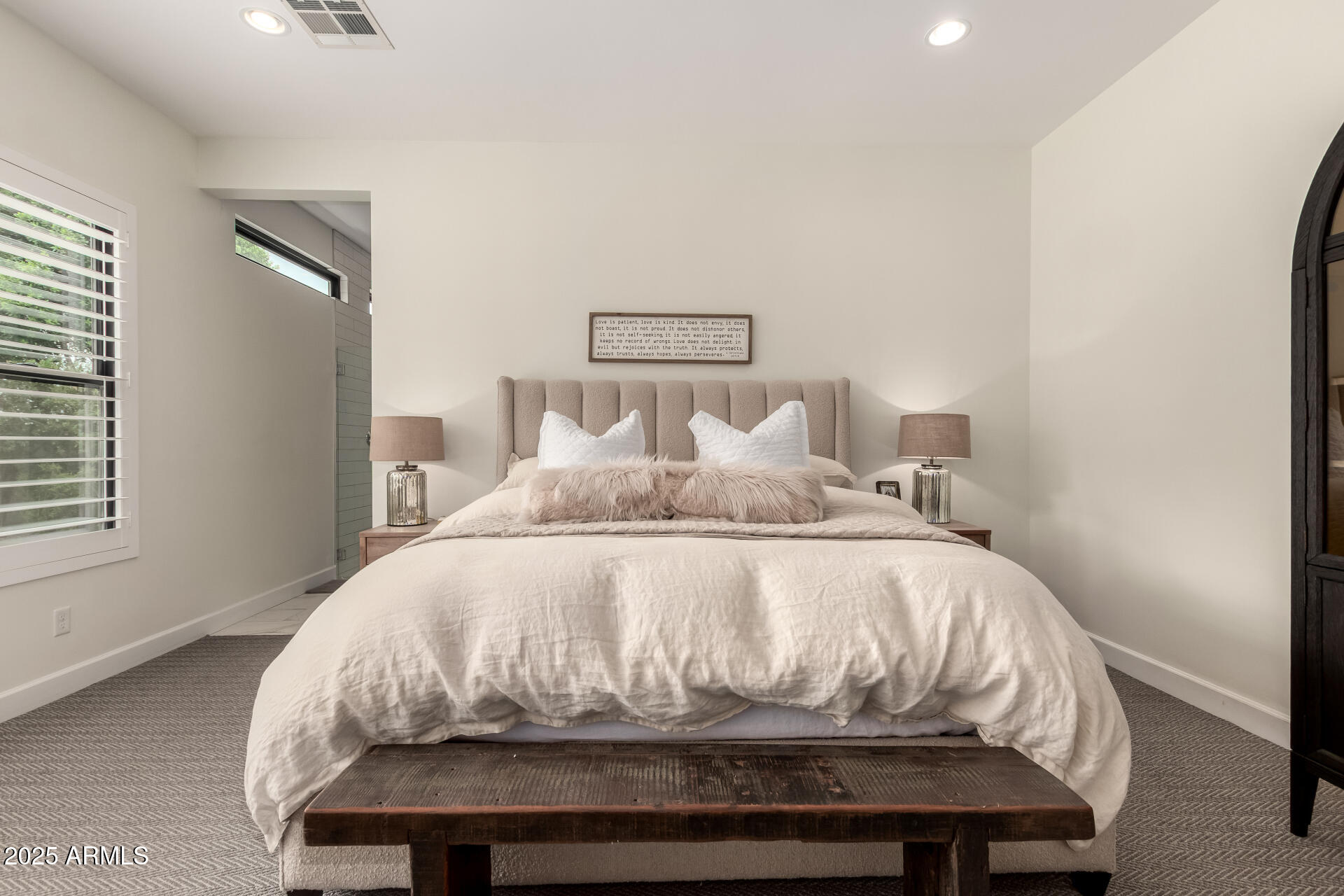 8723 North 9th Avenue Phoenix, AZ 85021 - Photo 18 of 34 a bed sitting in a bedroom next to a window