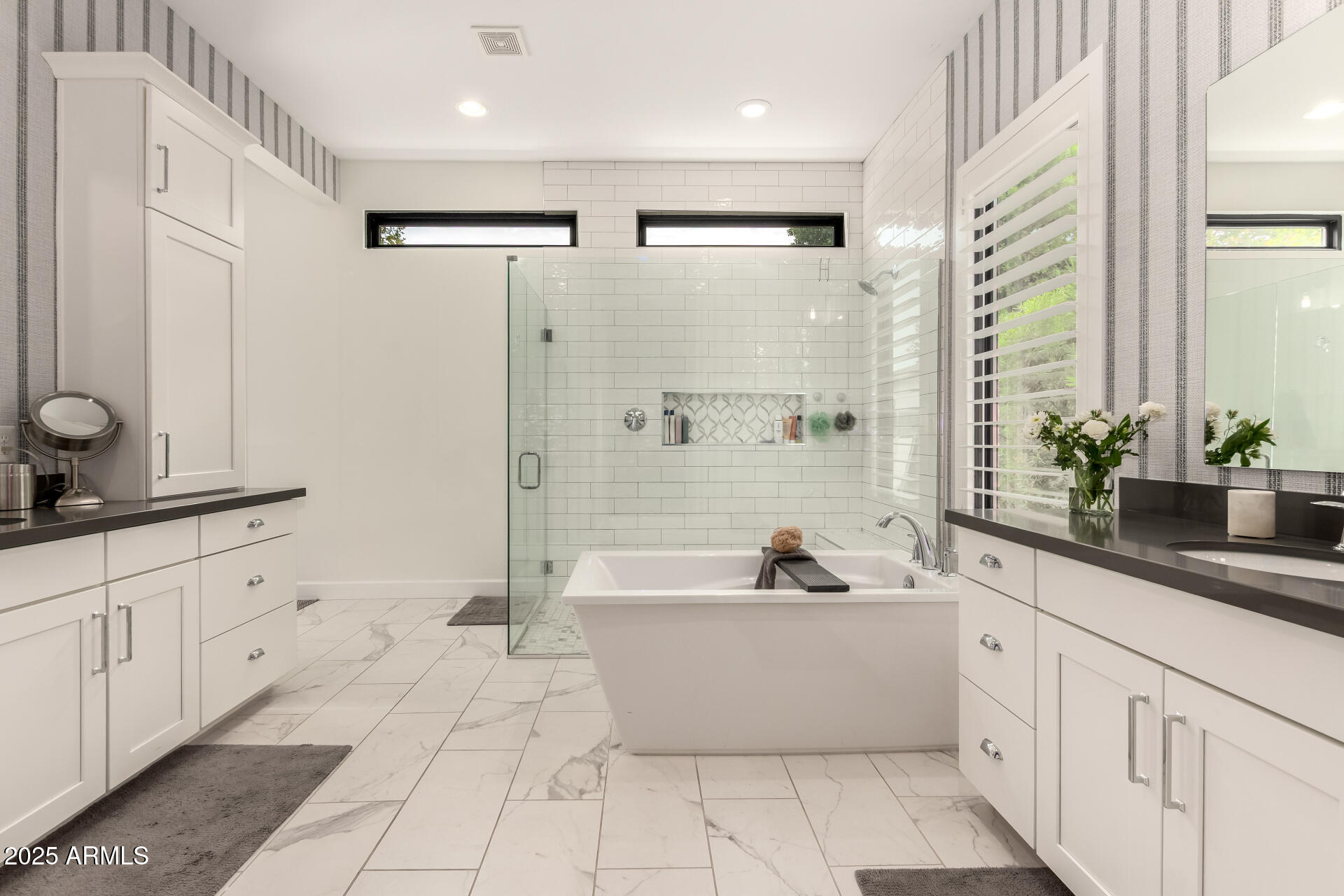 8723 North 9th Avenue Phoenix, AZ 85021 - Photo 19 of 34 a bathroom with a double vanity sink a mirror a bathtub and next to a window
