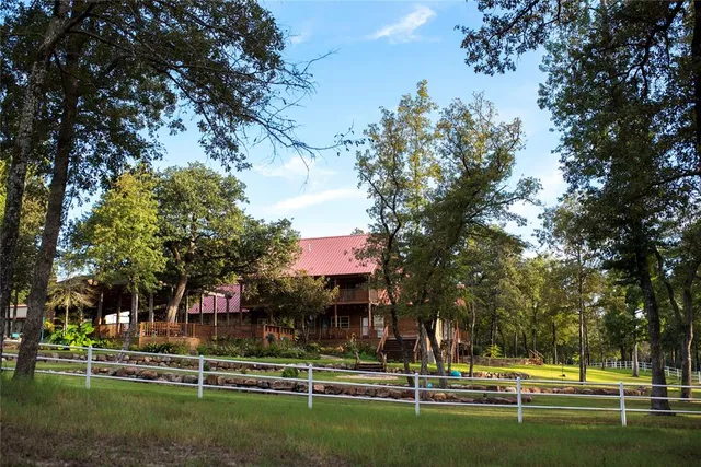a view of a house with a tree