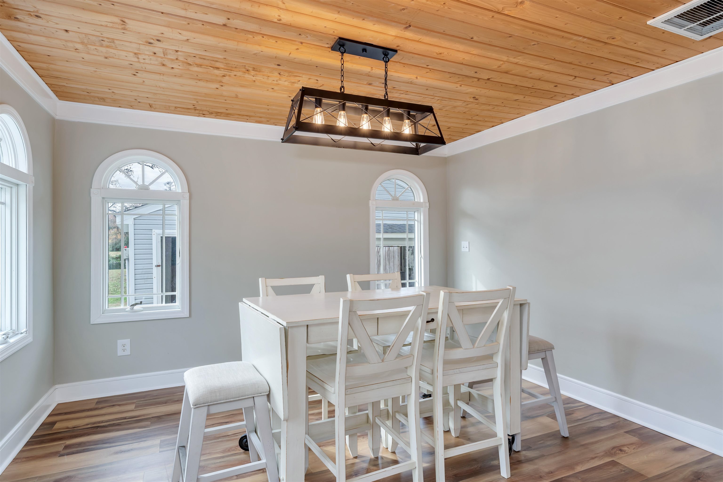 667 Dias Creek Road Cape May Court House, NJ 08210 - Photo 14 of 43 a view of a dining room with furniture and wooden floor