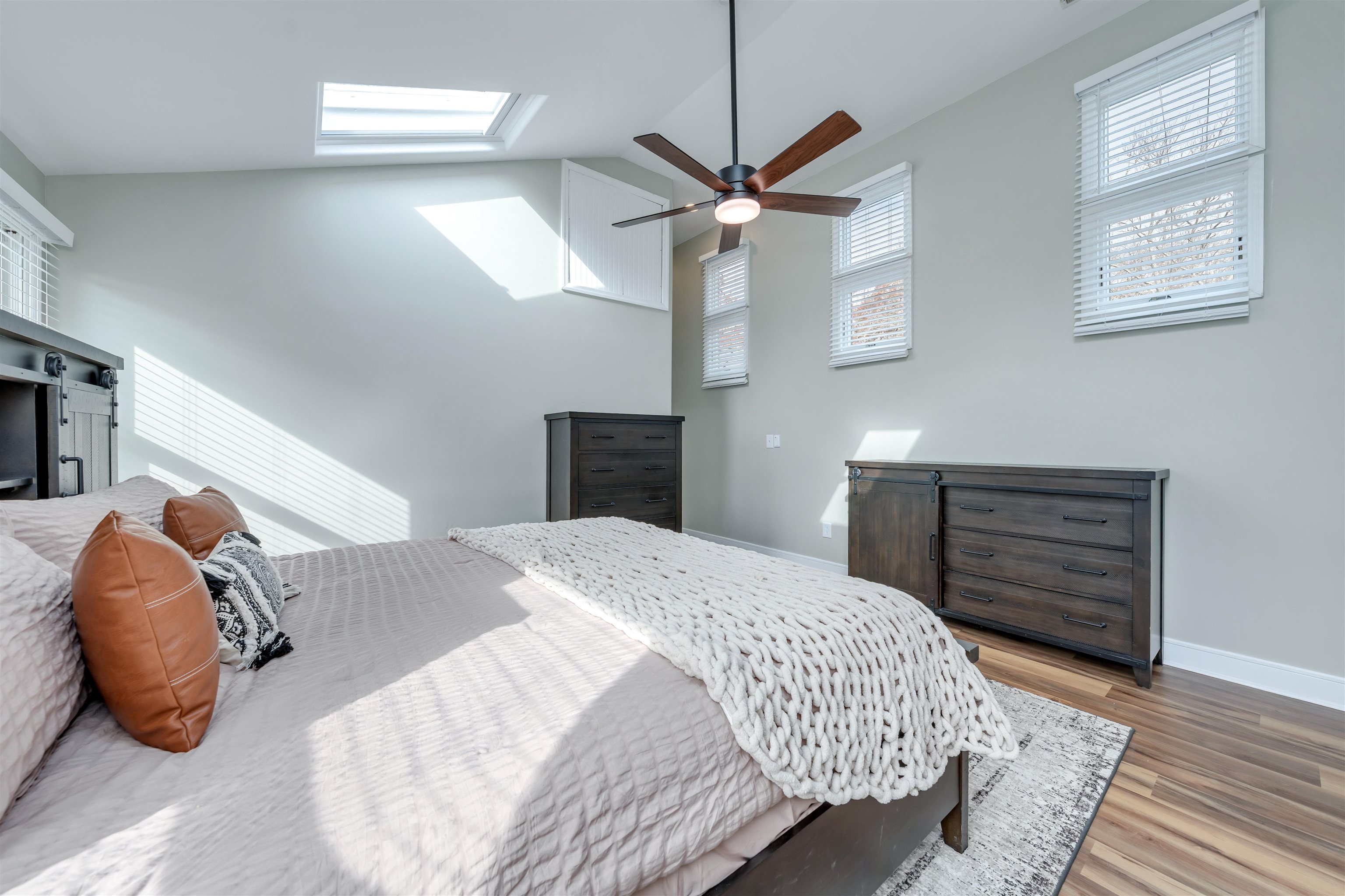 667 Dias Creek Road Cape May Court House, NJ 08210 - Photo 26 of 43 a bedroom with a bed and a chandelier