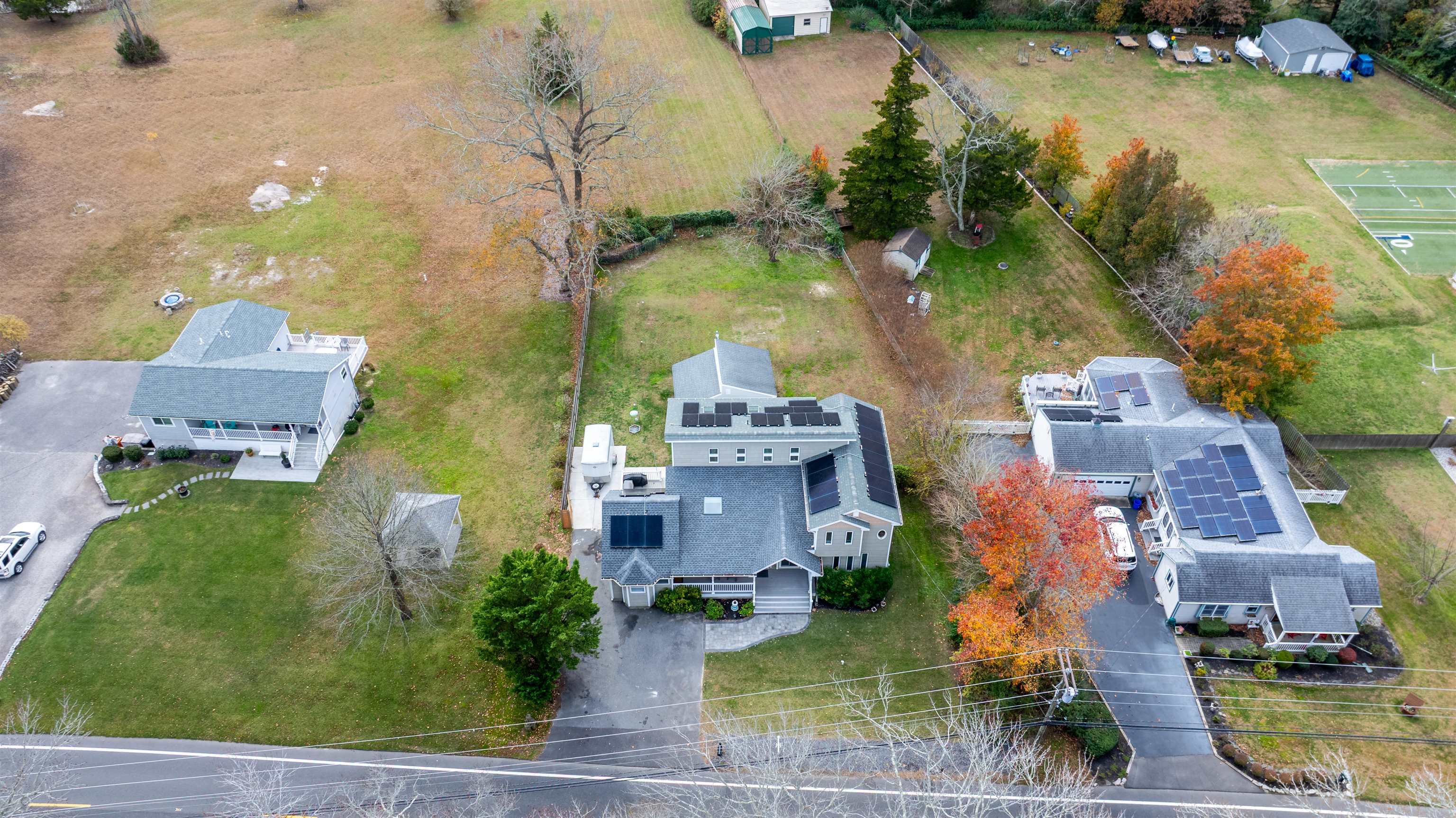 667 Dias Creek Road Cape May Court House, NJ 08210 - Photo 3 of 43 an aerial view of residential houses with outdoor space and swimming pool
