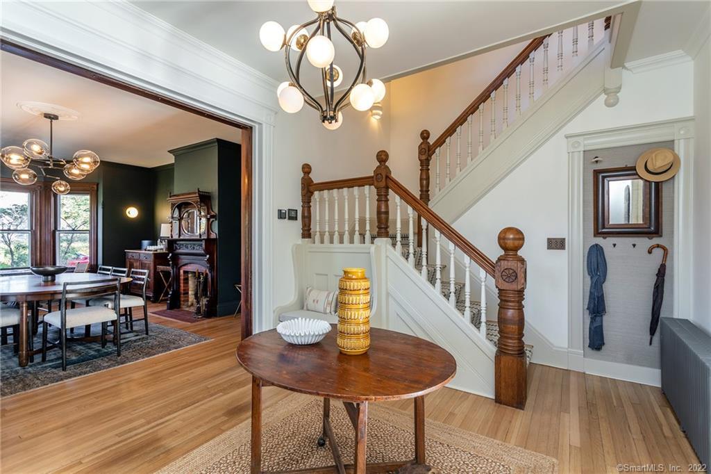 49 Christian Street Washington, CT 06777 - Photo 12 of 40 a view of a dining room with furniture a chandelier and wooden floor
