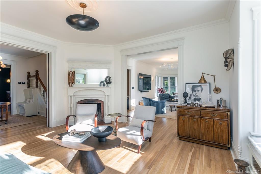 49 Christian Street Washington, CT 06777 - Photo 15 of 40 a living room with furniture a fireplace and wooden floor