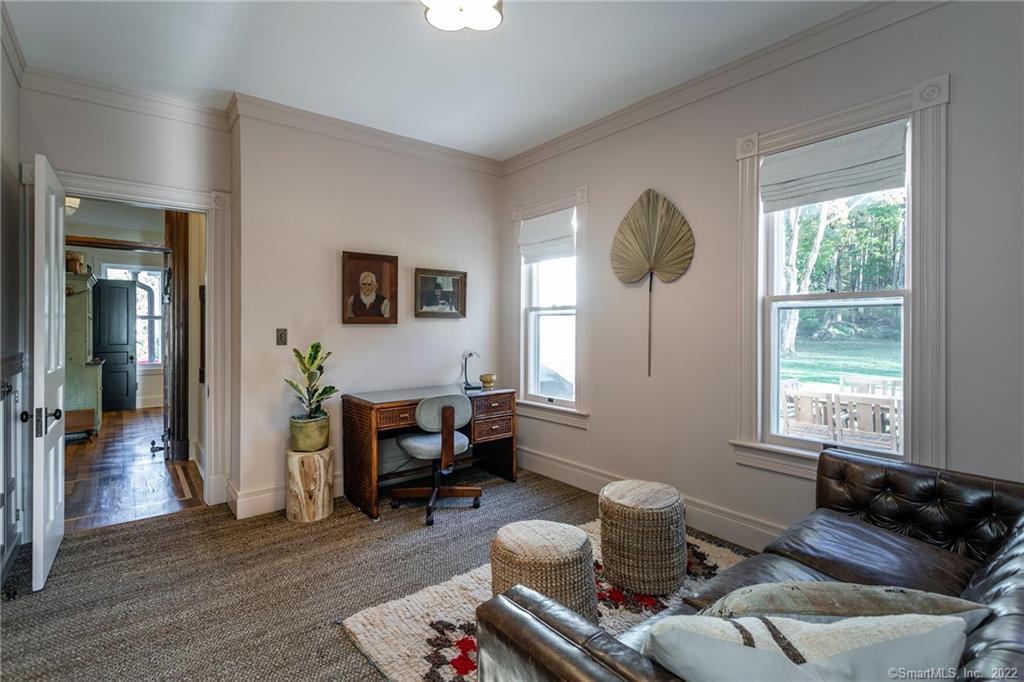 49 Christian Street Washington, CT 06777 - Photo 19 of 40 a living room with furniture and a window