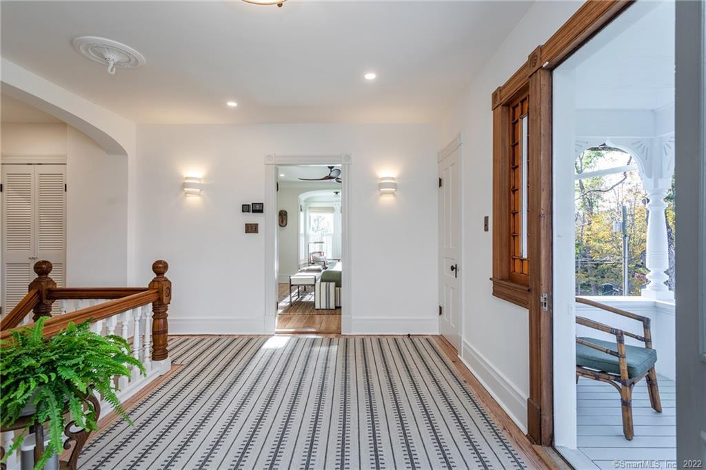 49 Christian Street Washington, CT 06777 - Photo 21 of 40 a view of hallway with wooden floor and livingroom view