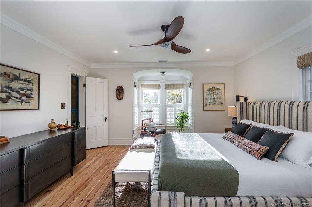 49 Christian Street Washington, CT 06777 - Photo 22 of 40 a bedroom with a bed and wooden floor