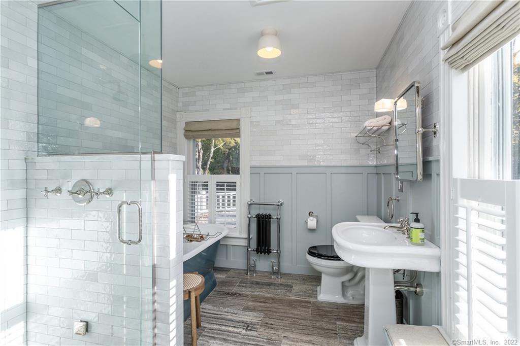 49 Christian Street Washington, CT 06777 - Photo 24 of 40 a bathroom with a sink two mirror and shower