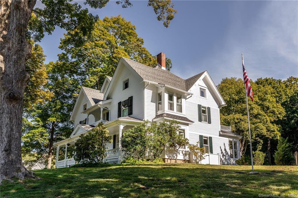 49 Christian Street Washington, CT 06777 - Photo 35 of 40 a front view of a house with a garden