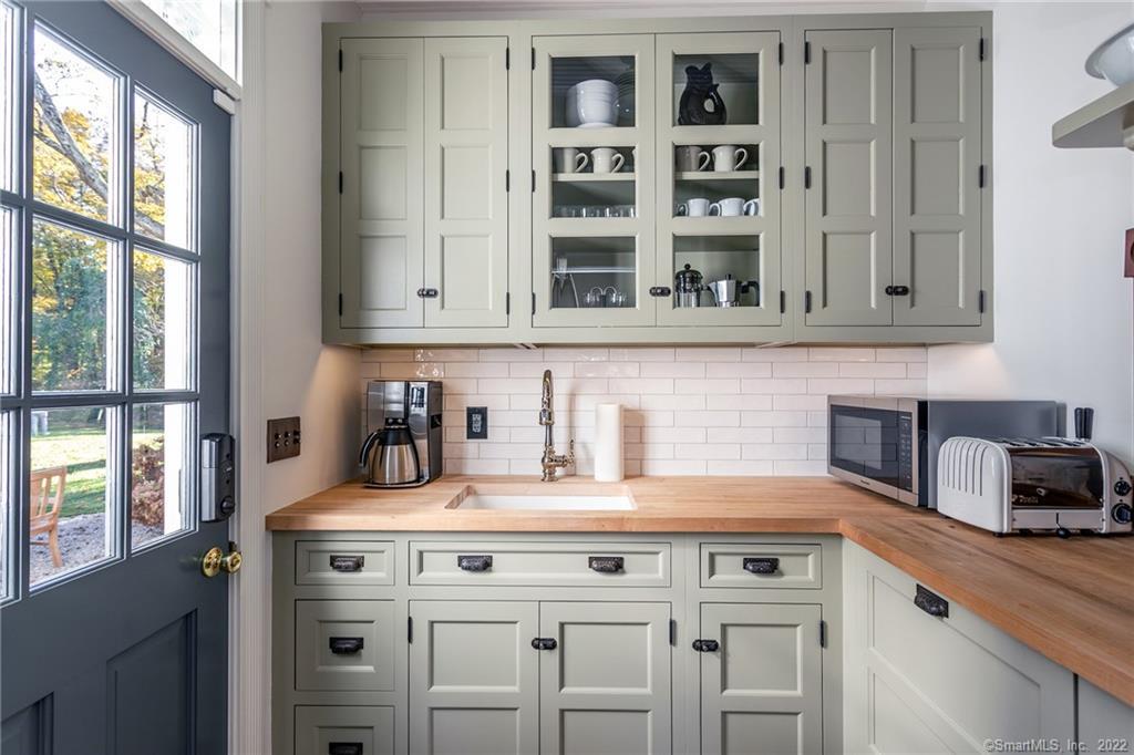 49 Christian Street Washington, CT 06777 - Photo 9 of 40 a kitchen with cabinets and window