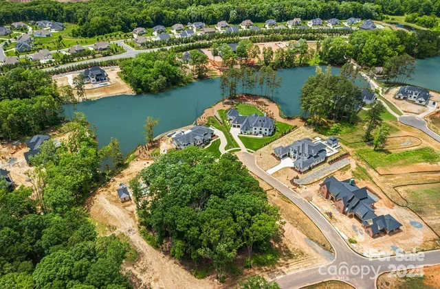 an aerial view of a house with a lake view