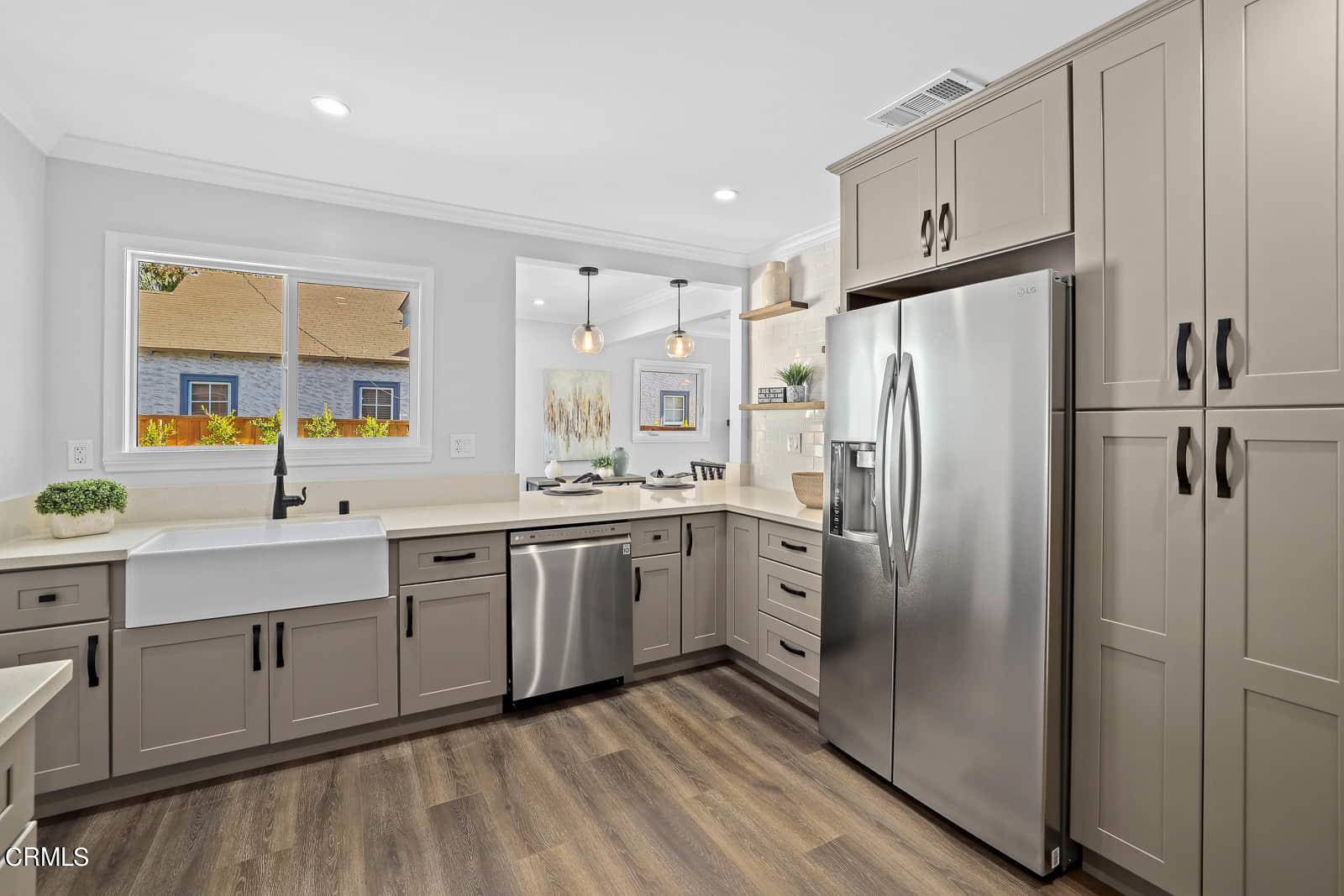 487 Crosby Street Altadena, CA 91001 - Photo 11 of 24 a kitchen with stainless steel appliances a refrigerator sink and cabinets