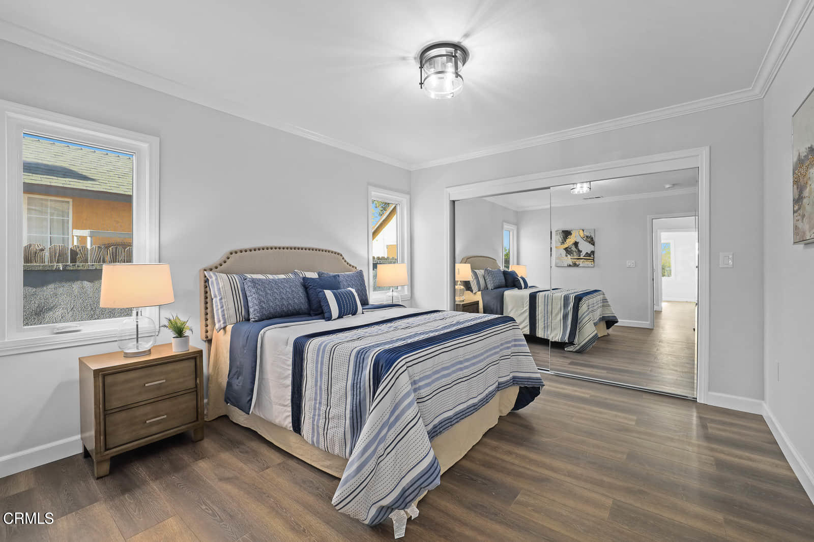 487 Crosby Street Altadena, CA 91001 - Photo 14 of 24 a bedroom with bed and a chandelier