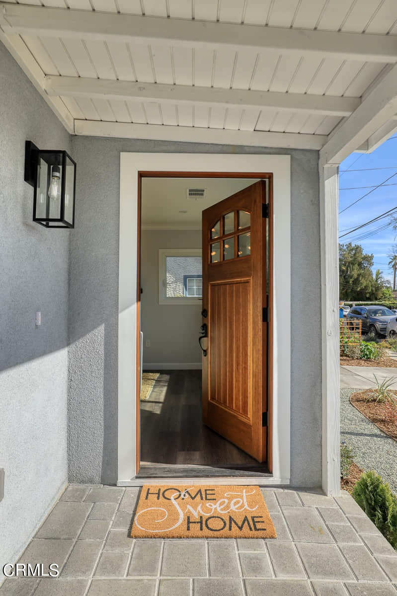 487 Crosby Street Altadena, CA 91001 - Photo 5 of 24 a view of a hallway with wooden floor and a living room