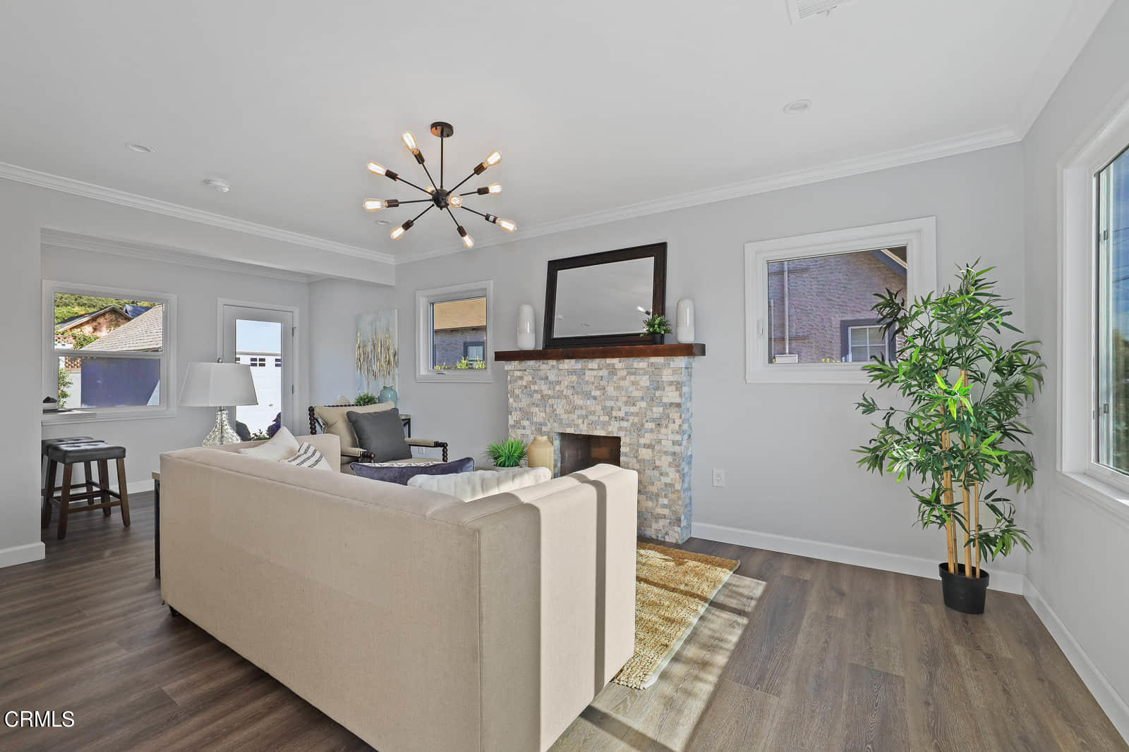 487 Crosby Street Altadena, CA 91001 - Photo 6 of 24 a living room with furniture a potted plant and a fireplace