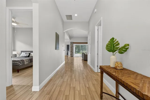 a kitchen with kitchen island a counter top space a sink and stainless steel appliances