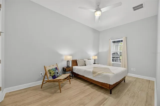 a bathroom with a shower a toilet and a glass door shower