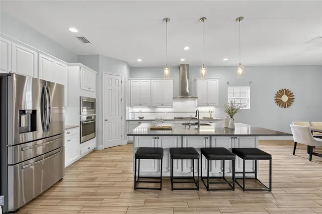 an aerial view of a house with a garden and swimming pool