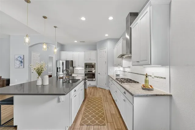 a view of a lake with houses in the background