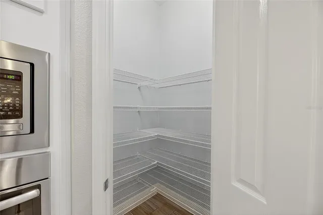 a kitchen with stainless steel appliances granite countertop a stove and a refrigerator