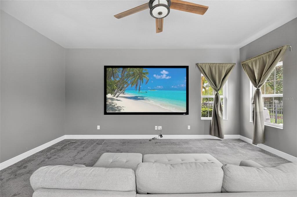 7223 Bowspirit Place Apollo Beach, FL 33572 - Photo 40 of 92 a living room with furniture and a flat screen tv