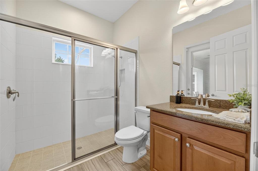 7223 Bowspirit Place Apollo Beach, FL 33572 - Photo 42 of 92 a bathroom with a granite countertop sink toilet and shower