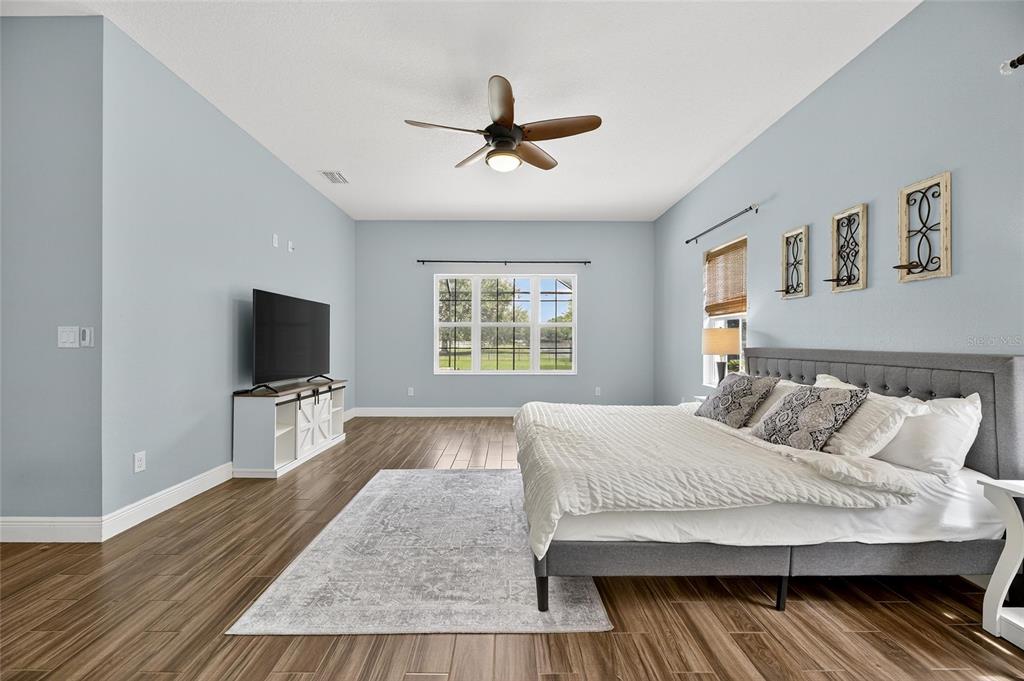 7223 Bowspirit Place Apollo Beach, FL 33572 - Photo 45 of 92 a bedroom with a large bed and a flat screen tv