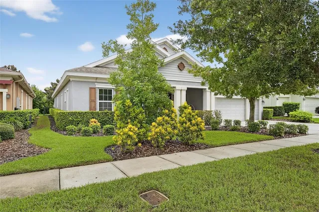 a bedroom with a bed and a lamp on table