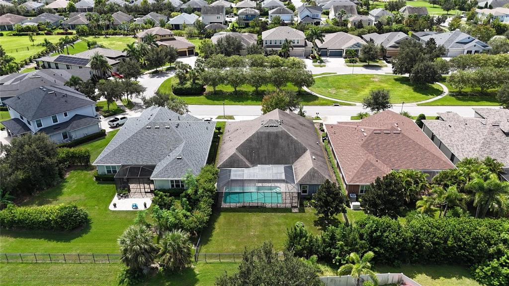 7223 Bowspirit Place Apollo Beach, FL 33572 - Photo 68 of 92 an aerial view of a house with swimming pool yard and outdoor seating