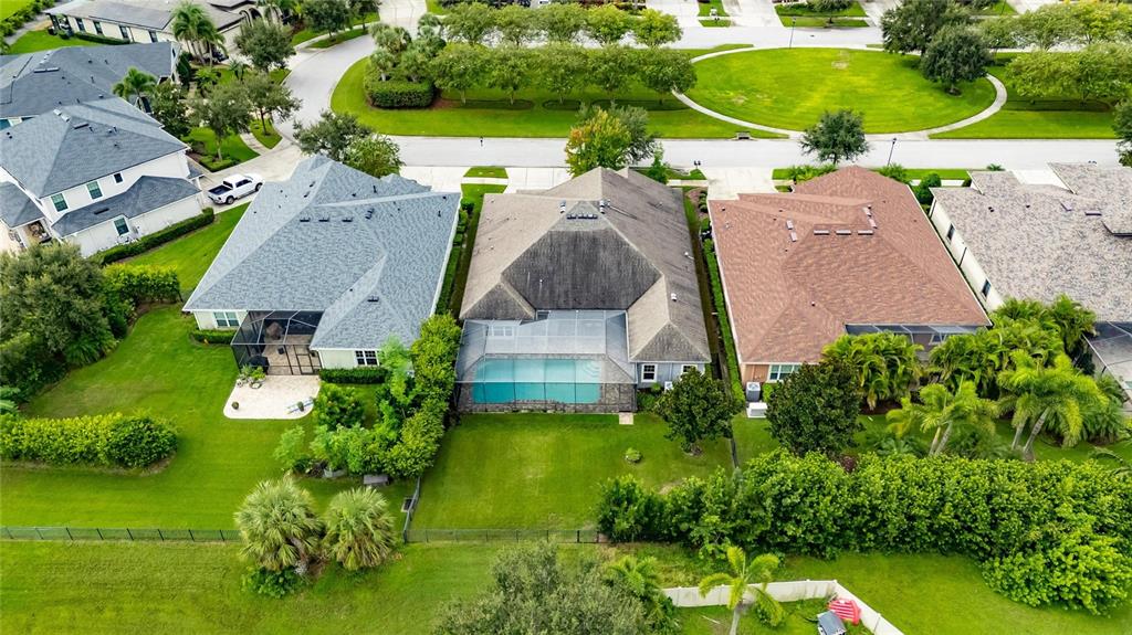 7223 Bowspirit Place Apollo Beach, FL 33572 - Photo 74 of 92 an aerial view of a house with a garden and swimming pool