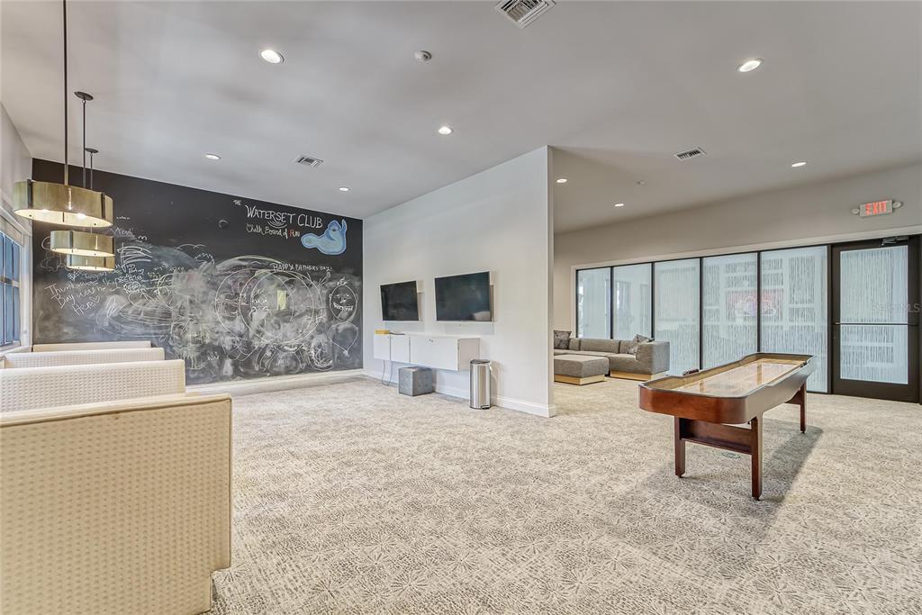 7223 Bowspirit Place Apollo Beach, FL 33572 - Photo 89 of 92 a living room with furniture a flat screen tv and large window