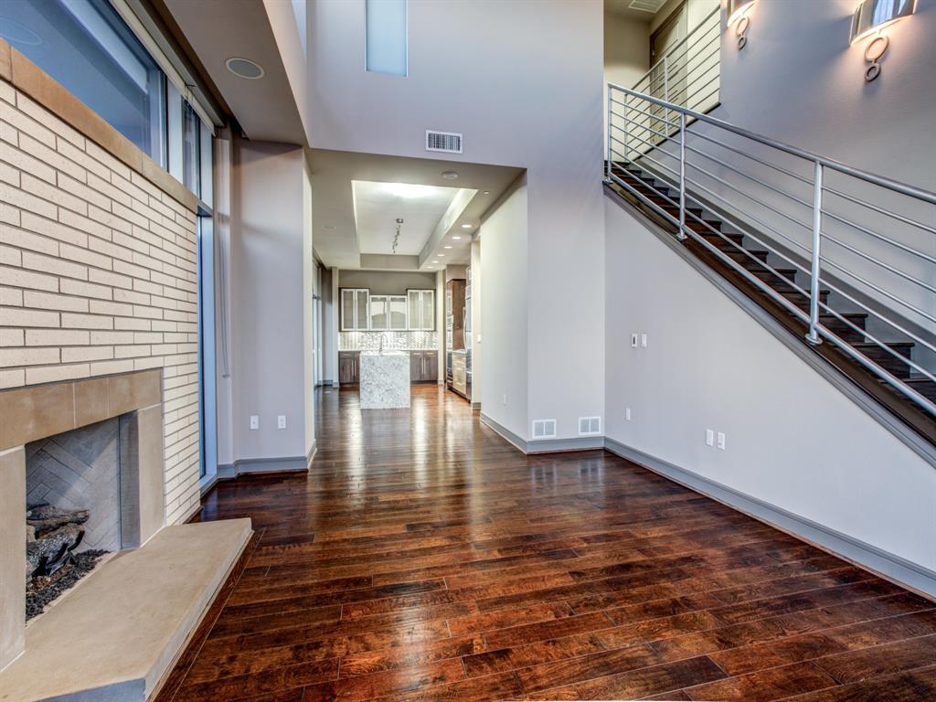 a view of an entryway with wooden floor