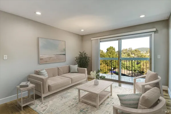 a living room with furniture and a large window