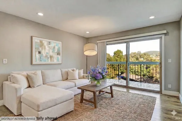 a living room with furniture and a large window