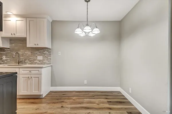 a kitchen that has a lot of cabinets in it