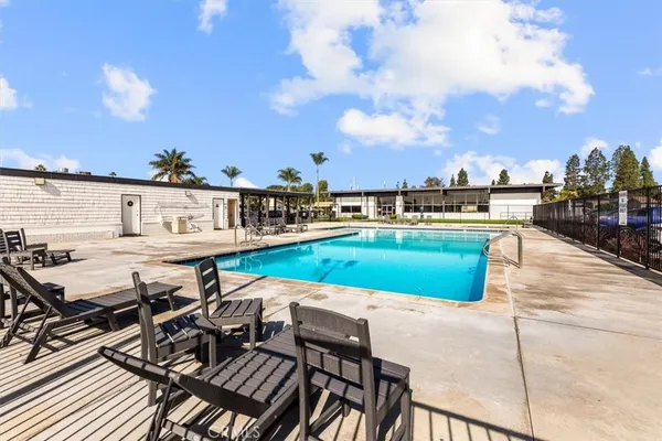 a view of a swimming pool with seating area