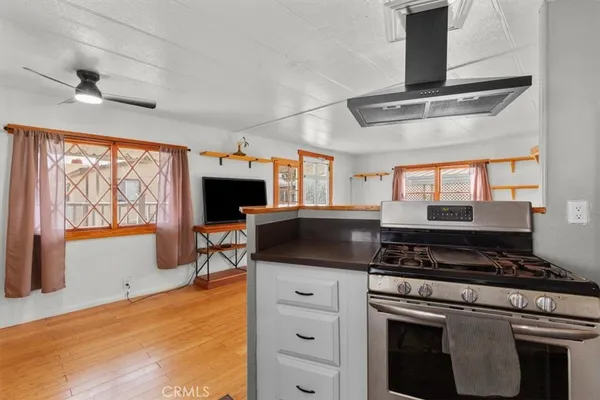 a kitchen with stainless steel appliances granite countertop a stove and a sink