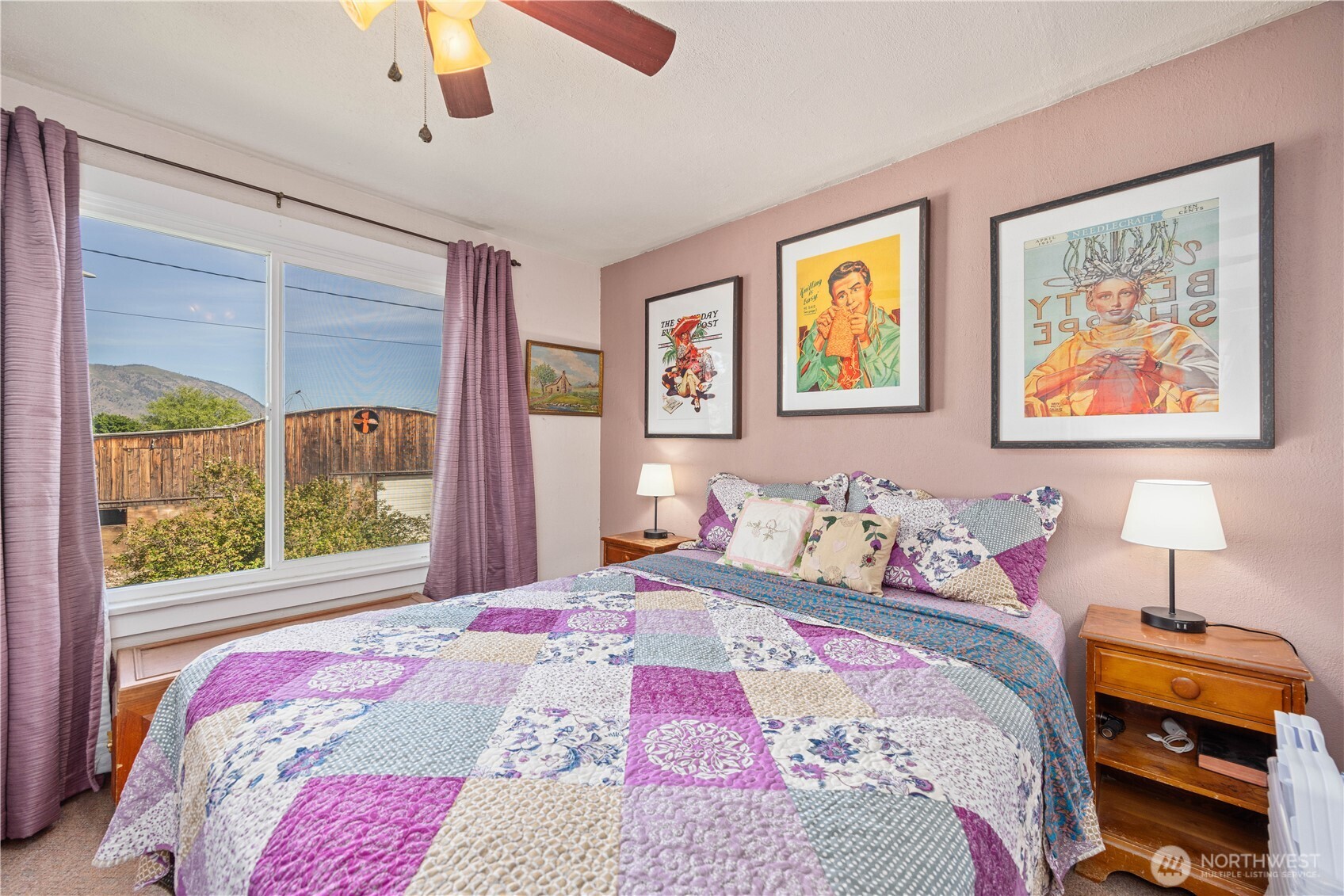1281 Totem Pole Road Manson, WA 98831 - Photo 15 of 39 a bedroom with a bed and a painting on the wall