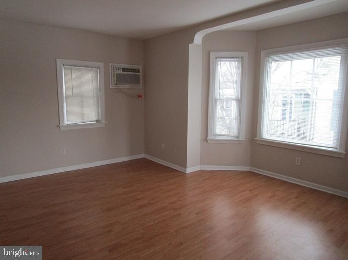 2557 Huntingdon Pike Huntingdon Valley, PA 19006 - Photo 5 of 9 a view of an empty room with wooden floor and a window