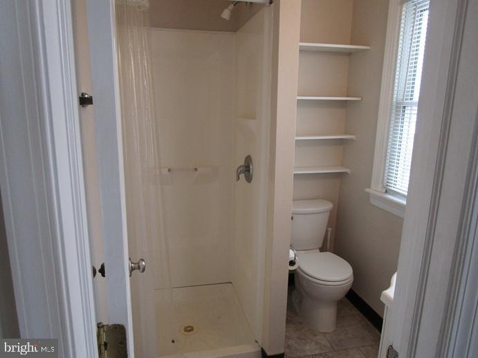 2557 Huntingdon Pike Huntingdon Valley, PA 19006 - Photo 8 of 9 a white toilet sitting next to a bathroom sink