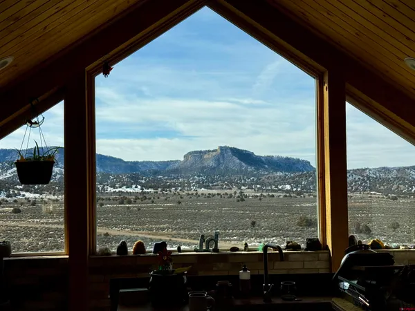 a front view of a house with a large window