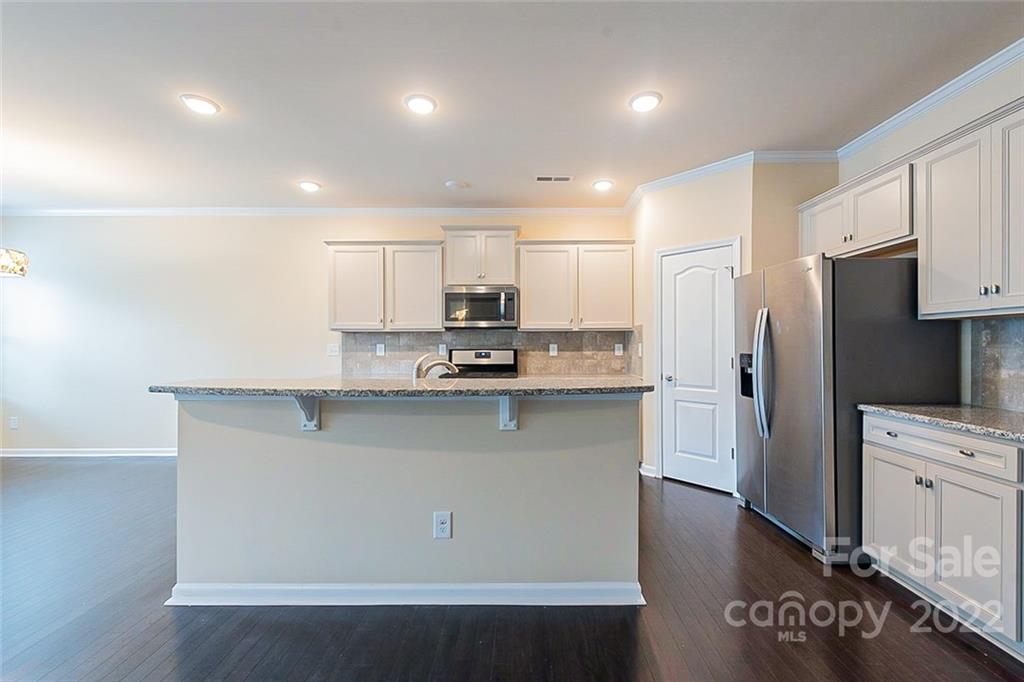210 Keating Pl Drive Fort Mill, SC 29708 - Photo 2 of 20 a kitchen with stainless steel appliances cabinets a sink and a counter
