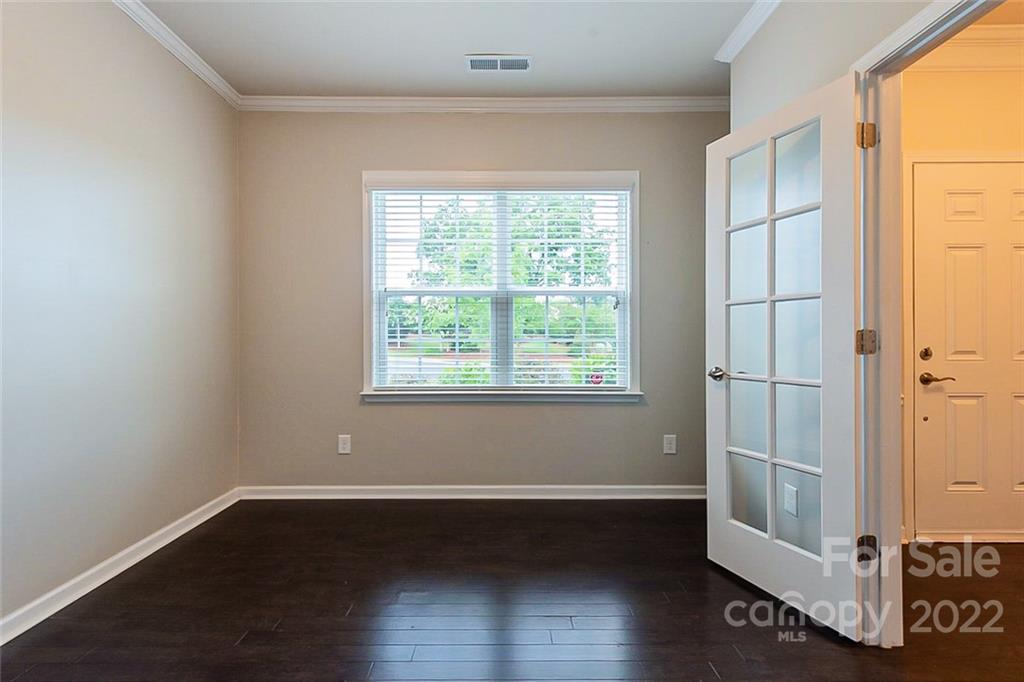 210 Keating Pl Drive Fort Mill, SC 29708 - Photo 6 of 20 an empty room with wooden floor and windows