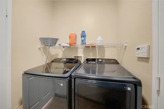 a kitchen with a sink a stove and cabinets