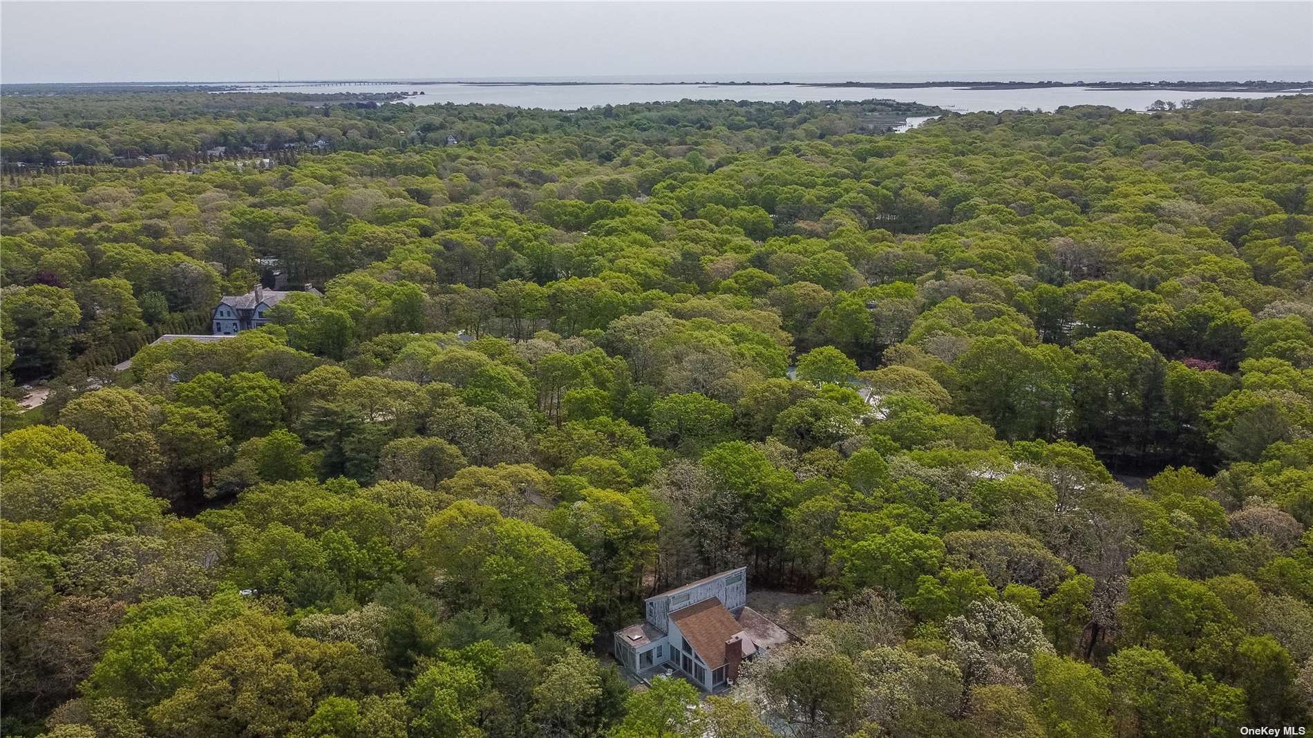 20 Midhampton Avenue Quogue, NY 11959 - Photo 1 of 1 a view of a field with an ocean