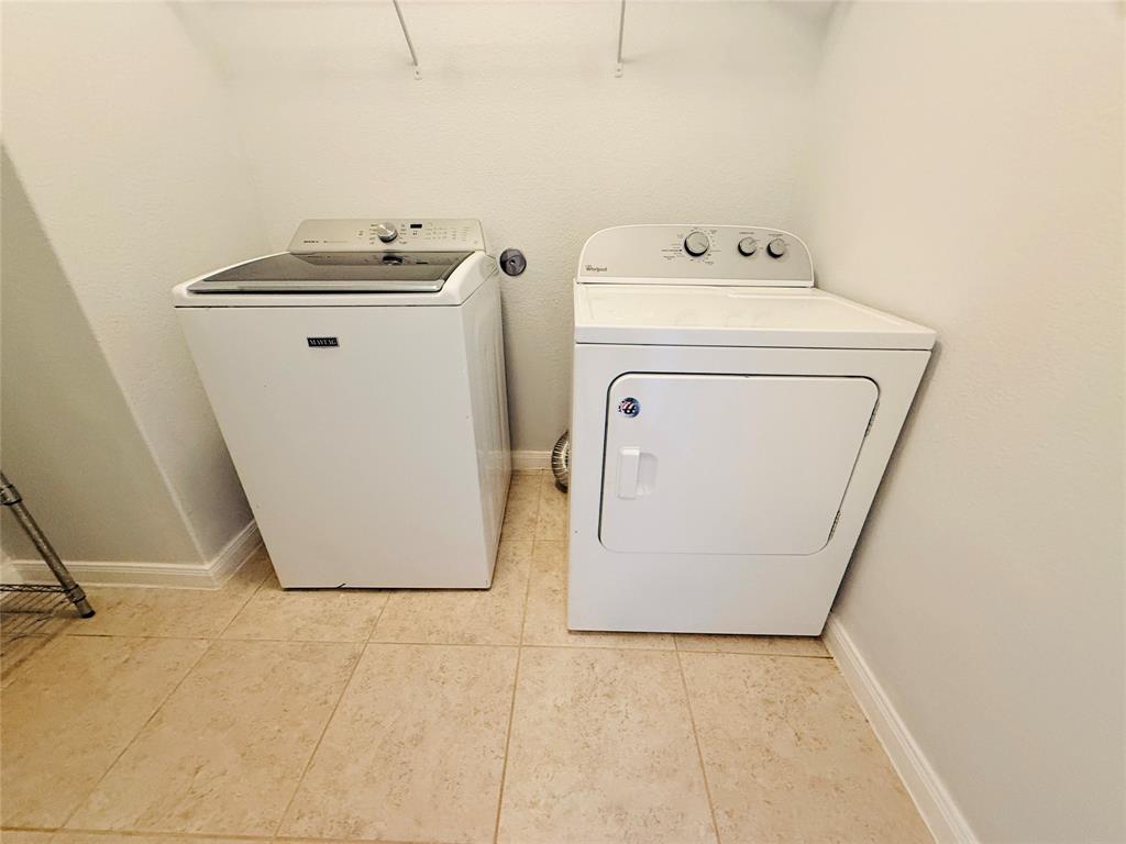223 Magnolia Drive Princeton, TX 75407 - Photo 19 of 29 a utility room with dryer and washer