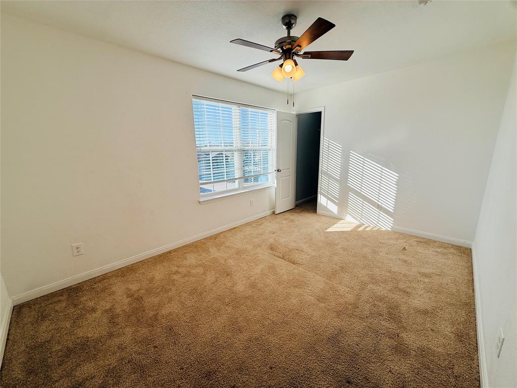 223 Magnolia Drive Princeton, TX 75407 - Photo 25 of 29 an empty room with windows