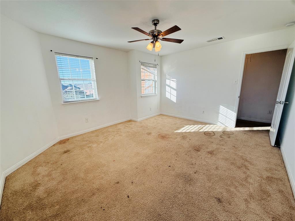223 Magnolia Drive Princeton, TX 75407 - Photo 26 of 29 a view of a big room with windows and chandelier fan