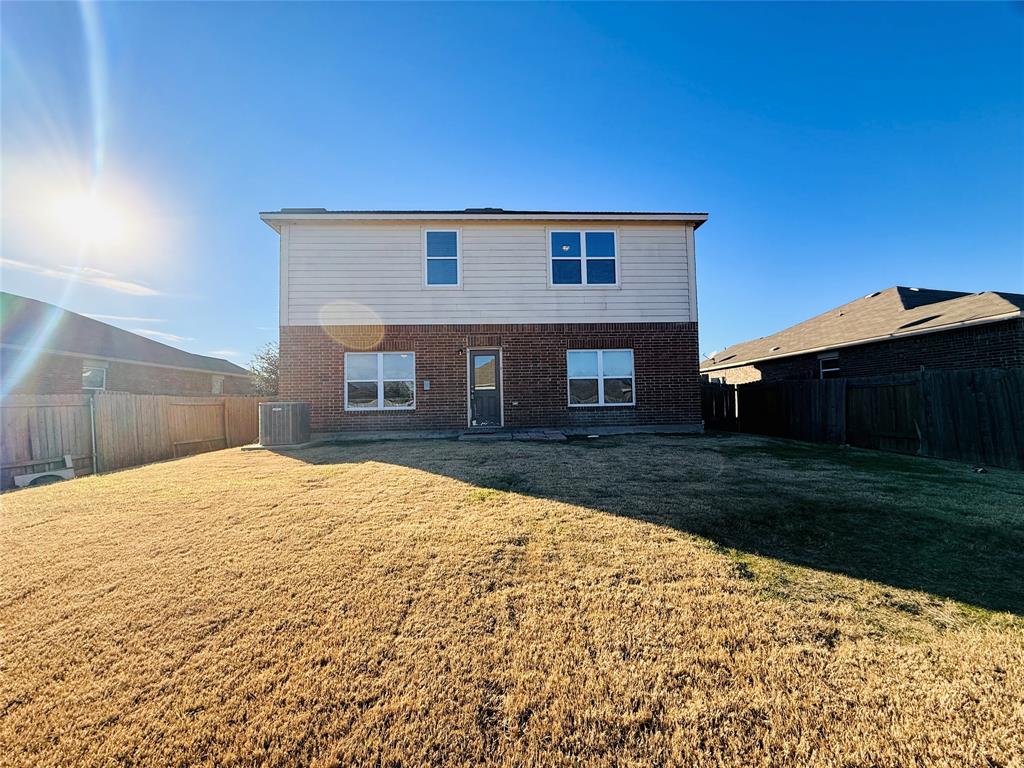 223 Magnolia Drive Princeton, TX 75407 - Photo 27 of 29 a backyard of a house